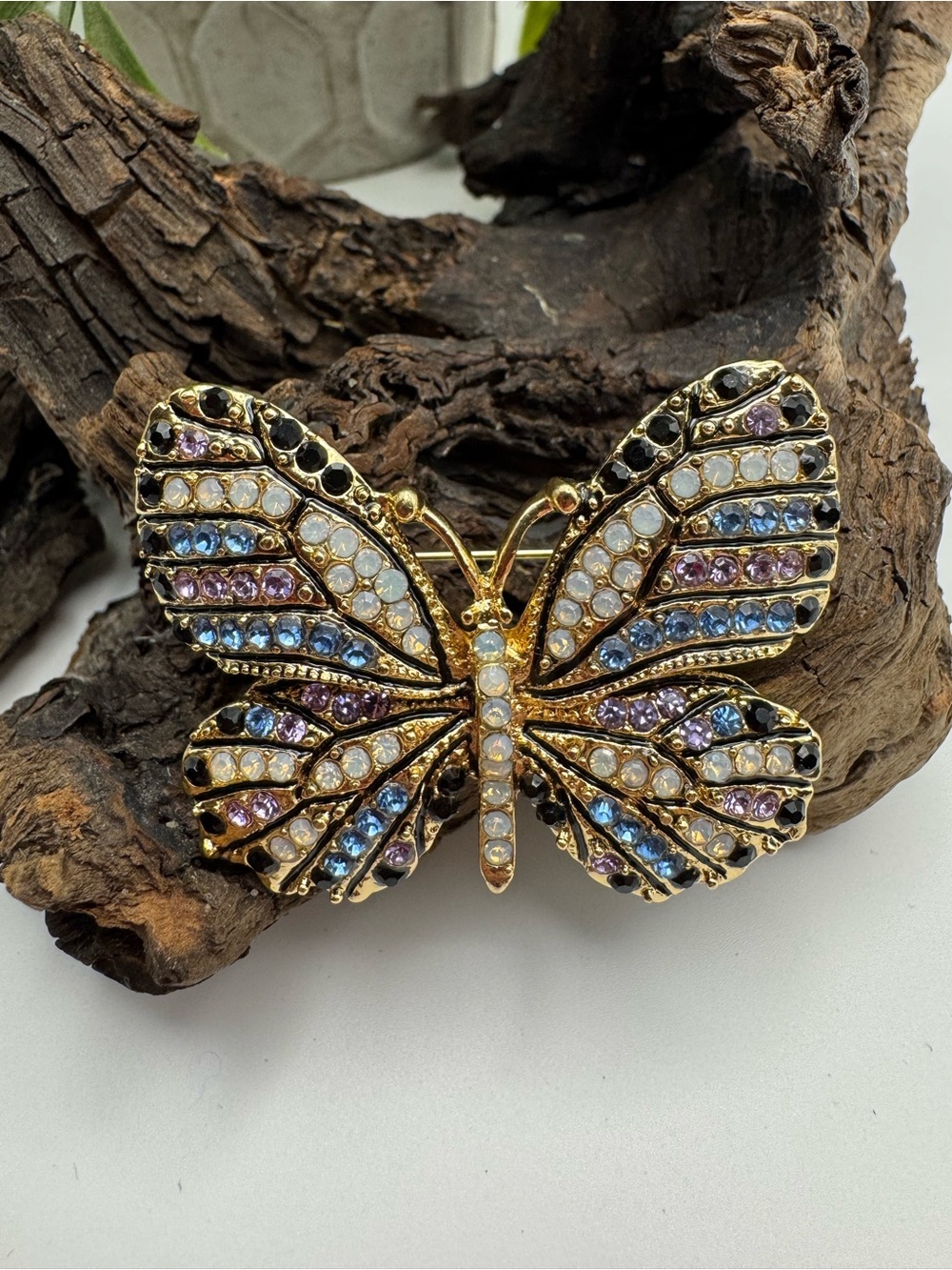 Butterfly brooch, EUC. Modern, gold-tone with multicolored rhinestones.
